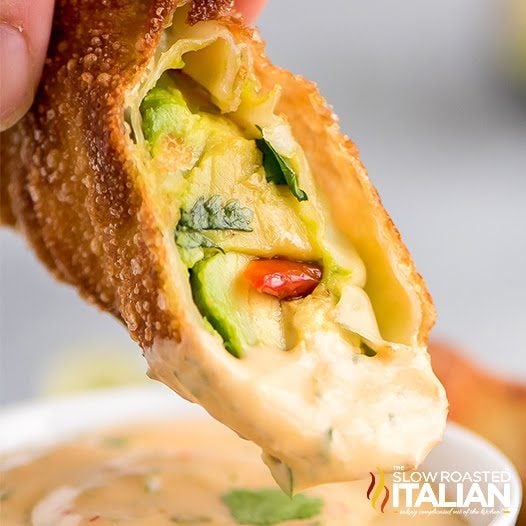 avocado egg roll dipped in sauce