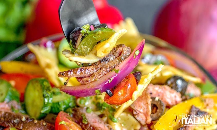 steak fajita pasta salad close up on fork