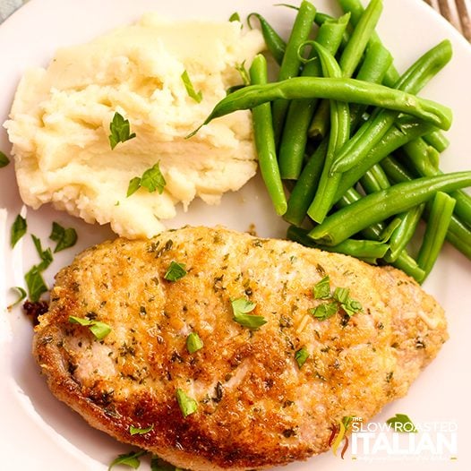Baked Parmesan Pork Chops with mashed potatoes and green beans
