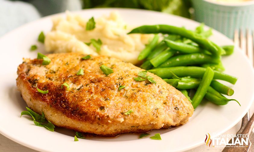 baked parmesan pork chop on white plate