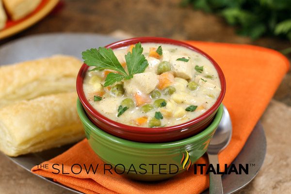 chicken pot pie soup garnished with basil