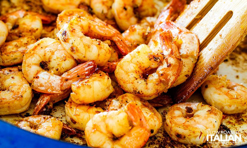 sautéing shrimp in a skillet.