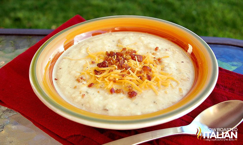 baked potato soup in bowl with spoon