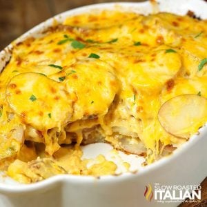 cheesy potatoes in white casserole dish