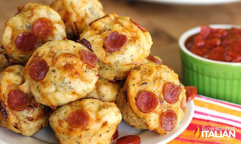 pizza bites with pepperoni stacked on a plate