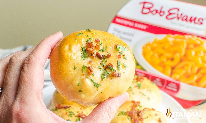 hand holding a bacon mac and cheese bomb