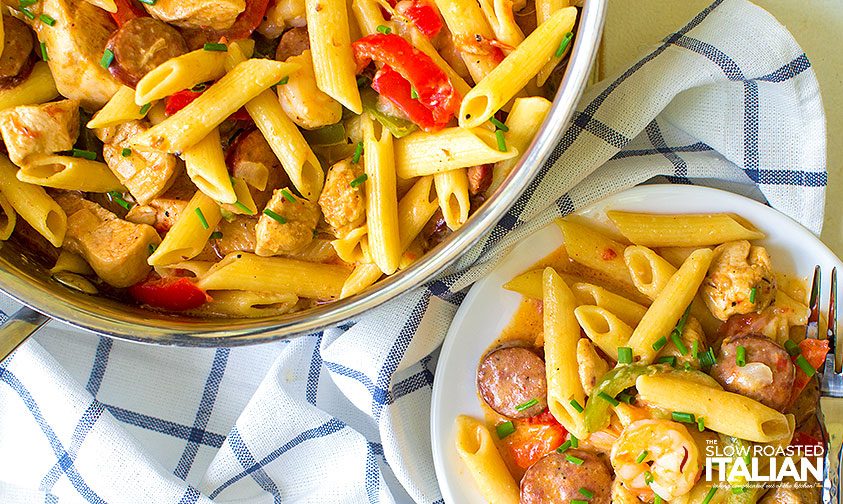 one pot jambalaya pasta sitting next to plate