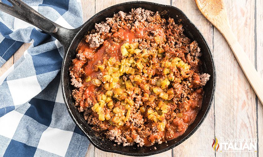 ground beef and mexican seasonings in cast iron skillet