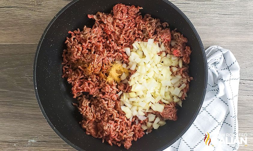 ground beef and onions in skillet