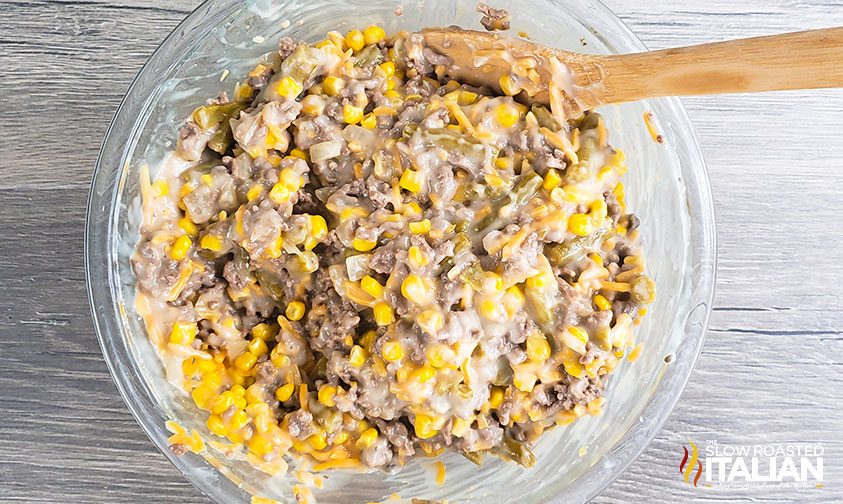 mixing tater to casserole ingredients