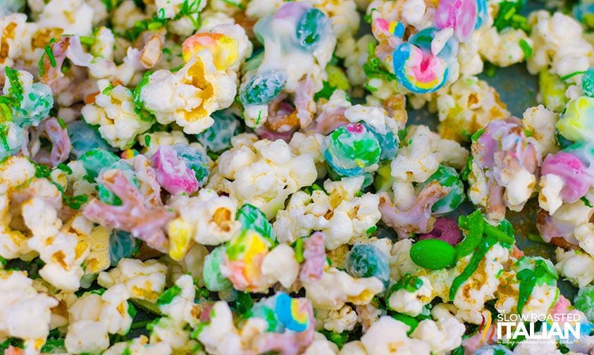 closeup: leprechaun bait snack mix with candy coated popcorn, Lucky Charms cereal, M&Ms, and sprinkles
