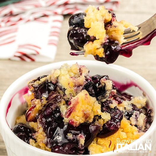 Bowl and fork full of Blueberry Dump Cake