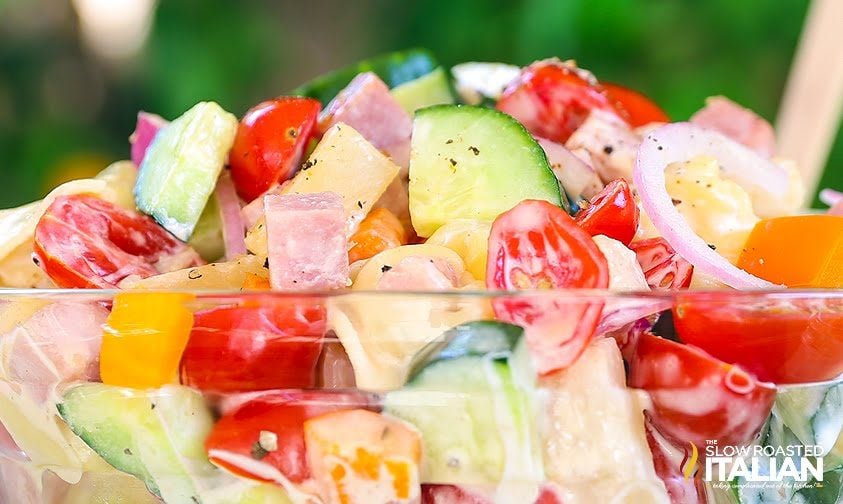 diced garden vegetables with ham and pineapple in clear glass bowl