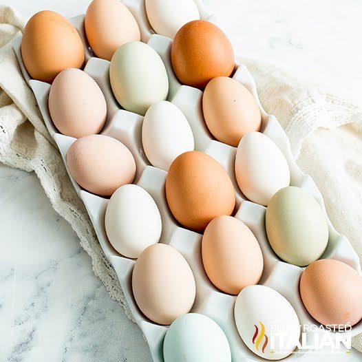 carton of white and brown chicken eggs