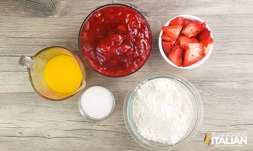 ingredients for strawberry dump cake in small bowls
