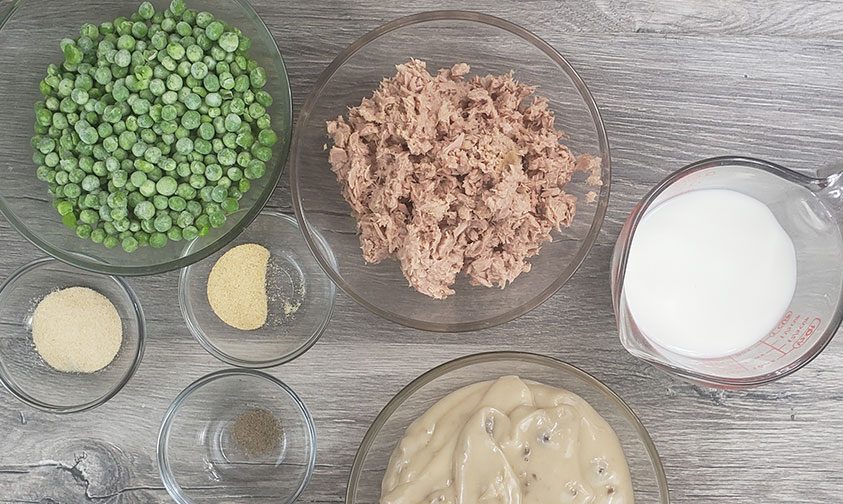 tuna noodle casserole recipe ingredients in bowls on counter