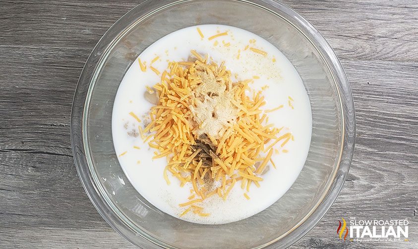 condensed soup, tuna fish and cheese in mixing bowl for tuna noodle casserole recipe