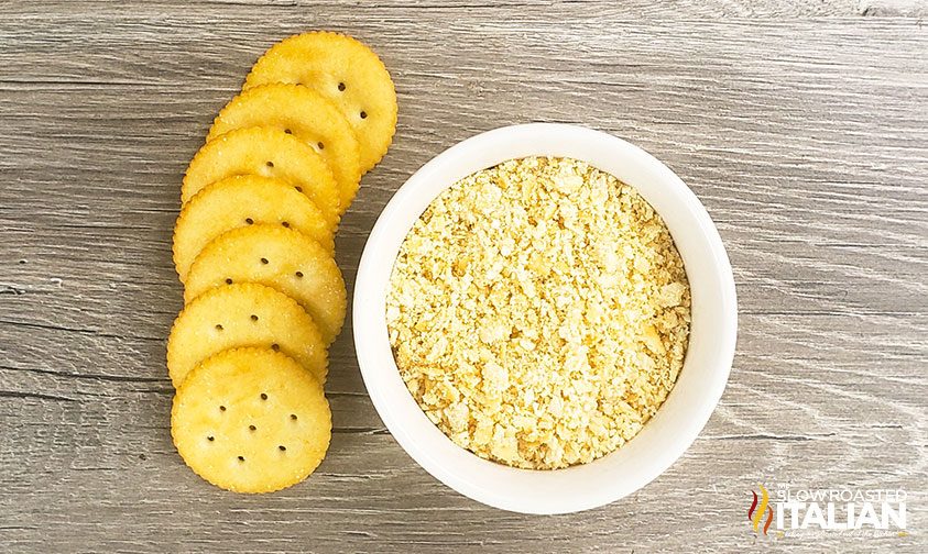 overhead Ritz cracker casserole topping in small bowl next to whole crackers