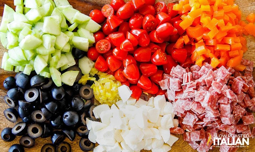 tuscan tortellini salad ingredients in bowl