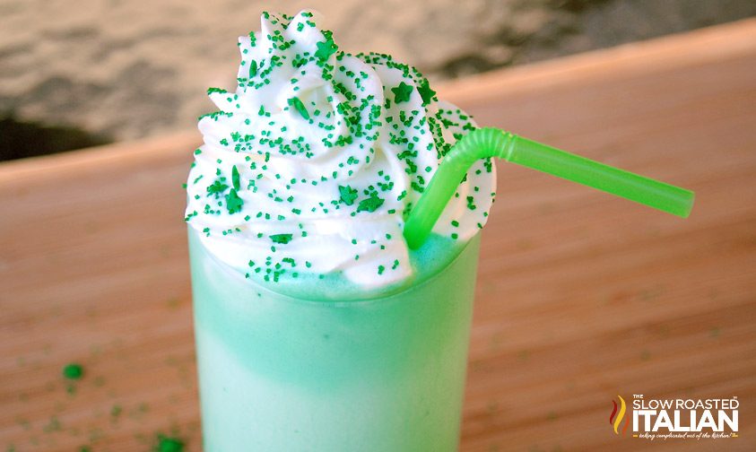 mint milkshake with whipped cream and sprinkles