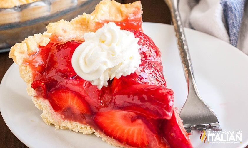 strawberry pie filling on homemade pie crust