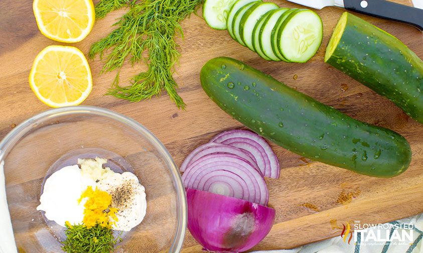 Cucumber Onion Dill Lemon on cutting board salad