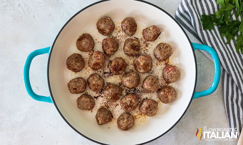 overhead: searing balls of ground beef in large pot