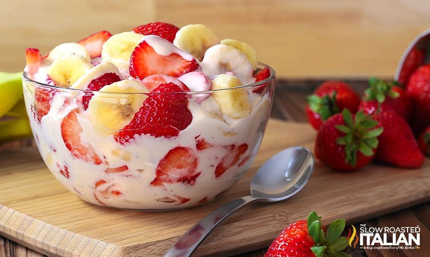Strawberry Banana Cheesecake Salad in a bowl, with a spoon