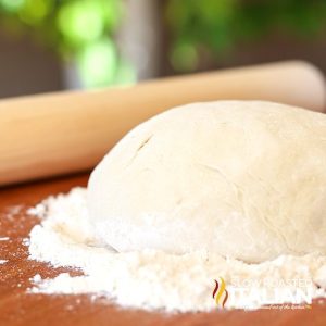 pizza dough resting in flour
