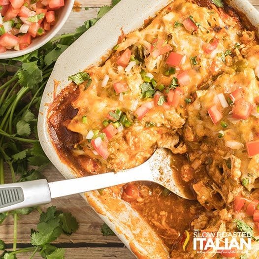 serving spoon in baked Tex Mex chicken casserole