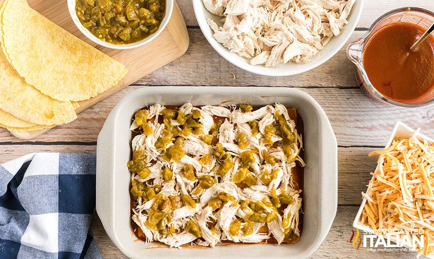 overhead: shredded white meat and diced chiles in baking dish
