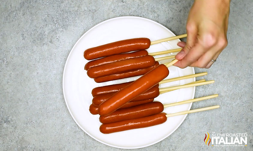 cooked hot dogs on sticks