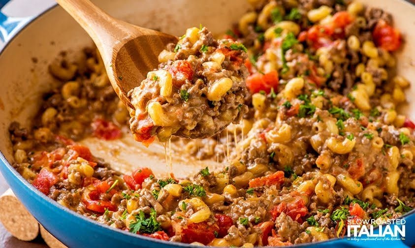 cheeseburger macaroni on spoon in skillet