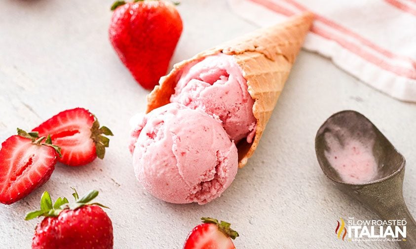 homemade strawberry ice cream in cone on counter