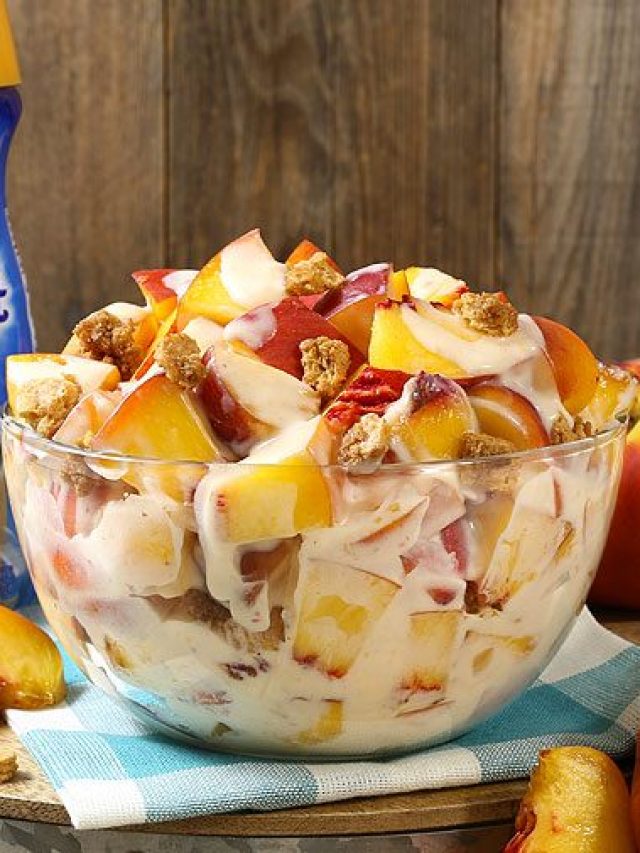 A bowl of fruit sitting on top of a wooden table