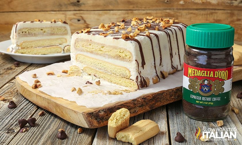 sliced tiramisu cake next to a jar of espresso instant coffee