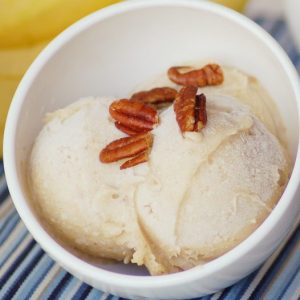Bowl of Frozen Banana Ice Cream with Pecans on top