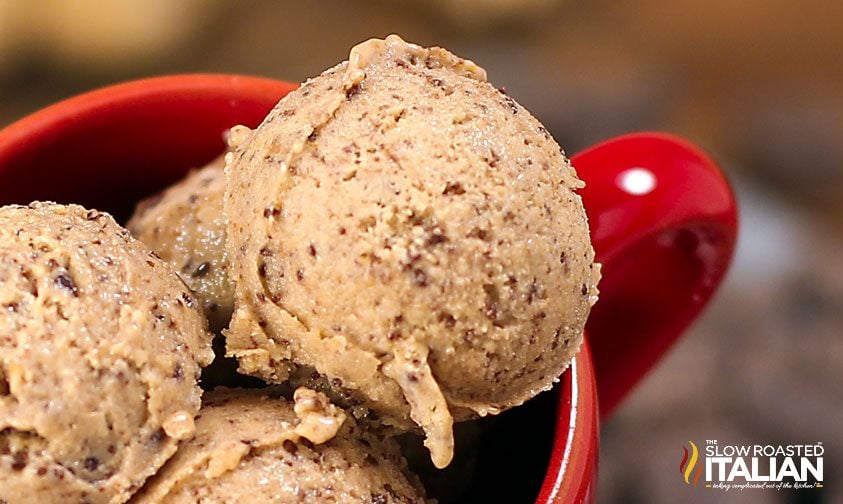 scoops of peanut butter chocolate ice cream in a red mug