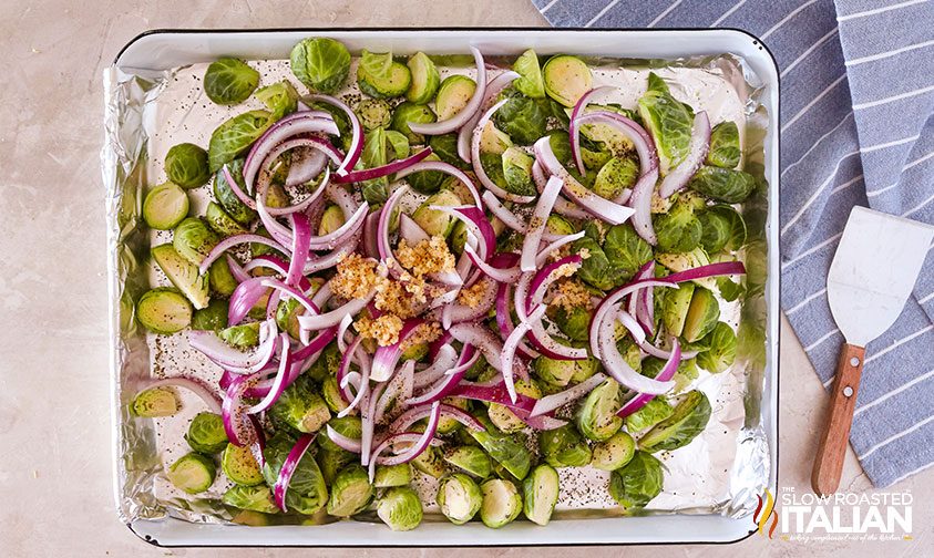 crispy brussel sprouts on a sheet pan tossed with oil