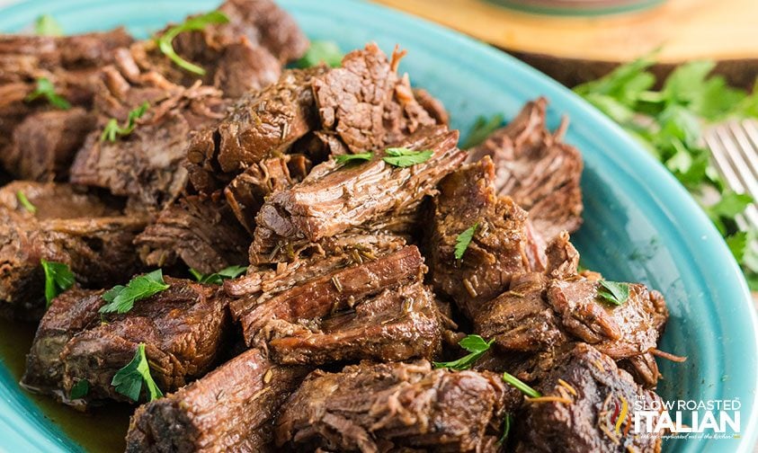 tender slow cooker pot roast in blue bowl