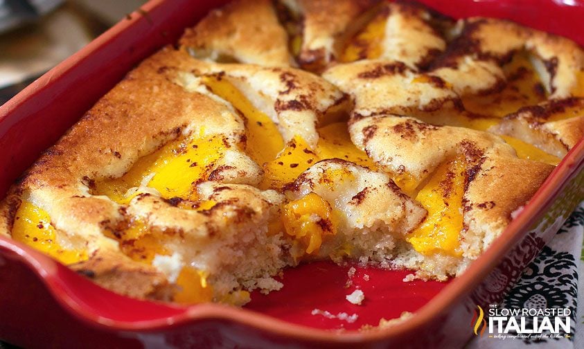 peach dessert in red serving dish