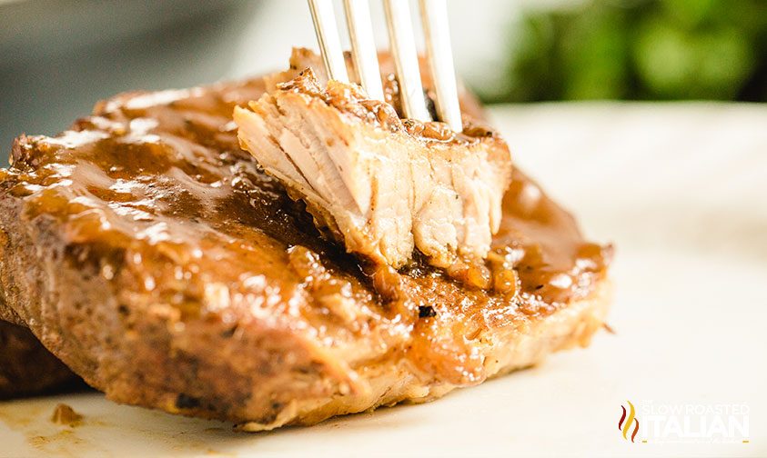 Instant Pot boneless pork chops sliced on a plate