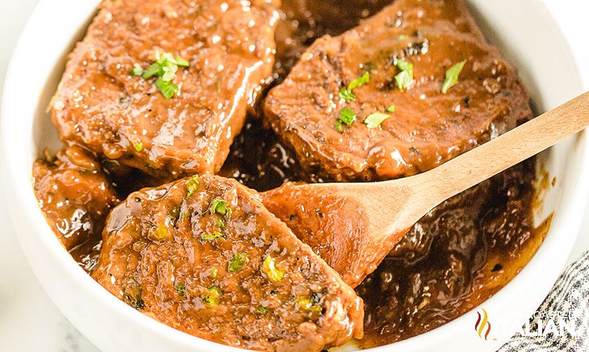 Instant Pot pork chops in a bowl with gravy