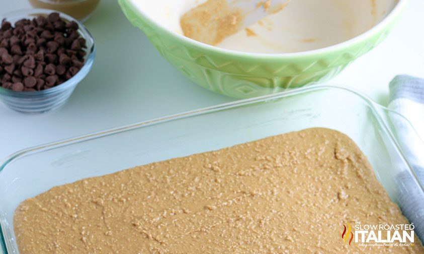 graham cracker crumbs pressed into a glass baking pan