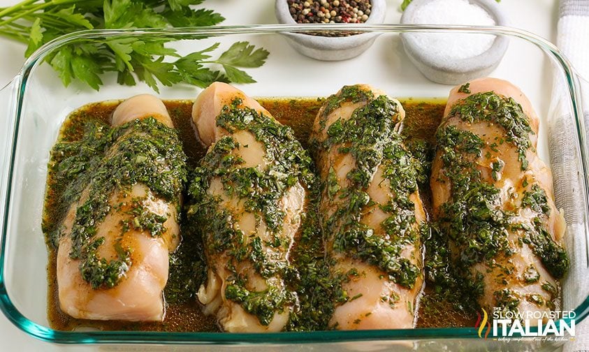 air fryer chicken breast marinating in a glass baking dish