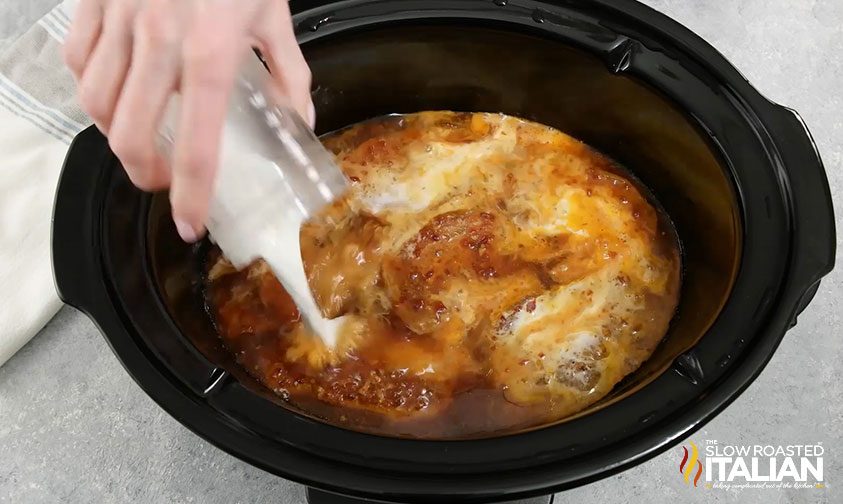 pouring the slurry in the slow cooker