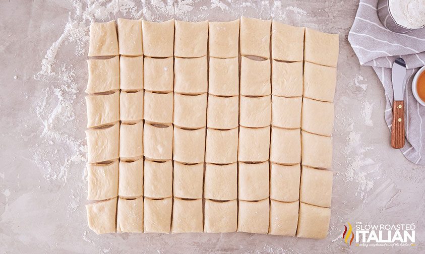 Dough cut into squares with a pizza cutter
