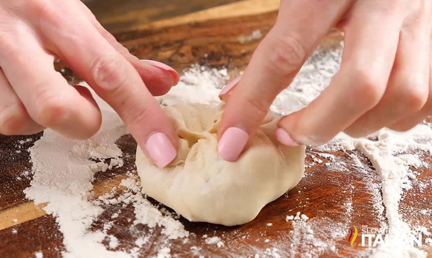 Crimping the edges for the caramel apple pie bombs