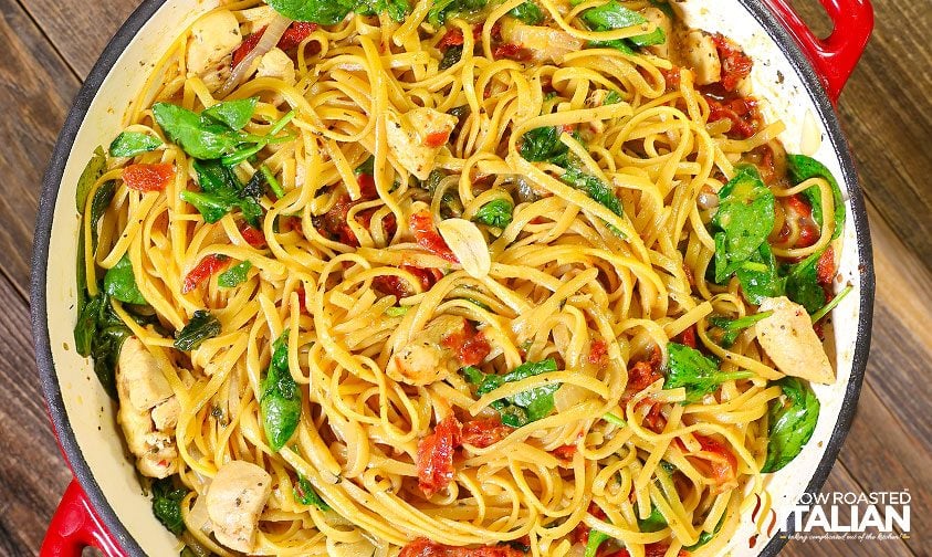 overhead: cheesy chicken pasta in pot