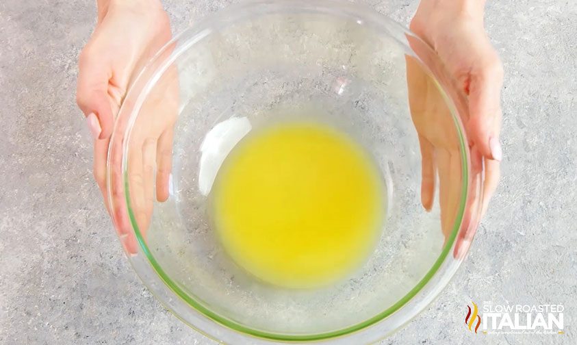 melted butter in large glass bowl